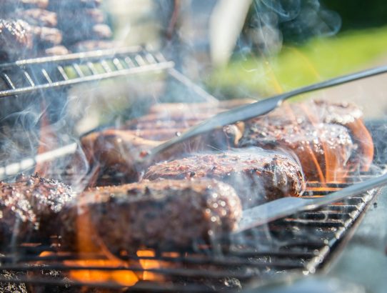 close photography of grilled meat on griddle